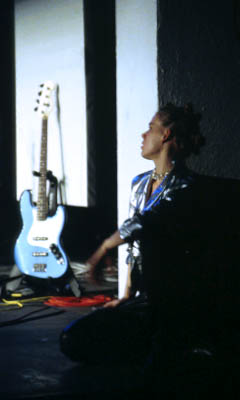 Sylvie (Amy Cronise) watches Silvertone from the wings.