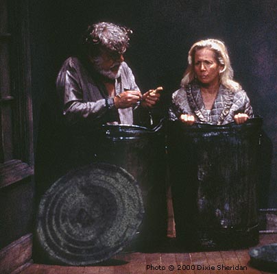 Nagg (Jack Marks) asks Nell (Eve Packer) if she would like a bit of his dog biscuit.