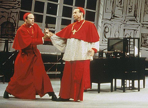 Cardinal Stillaci (John Hines) is restrained from shooting 
							Elisa by Cardinal Pialli (James Shanklin).