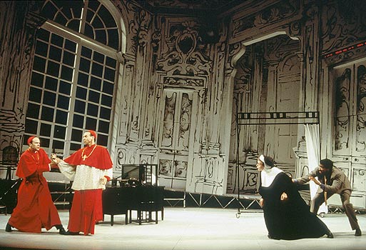 Elisa (Amy Cronise), held back by Professor Ridolfi 
						(Obi Ndefo) taunts Cardinal Stillaci (John Hines), who 
						is restrained from shooting her by Cardinal 
						Pialli (James Shanklin).