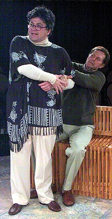 Leslie (John Alexander) advises Greg (Stephan Bradbury) to drop the leash and take up his wife's hand.